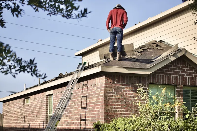 Professional roofer working on a residential roof in Waynesboro